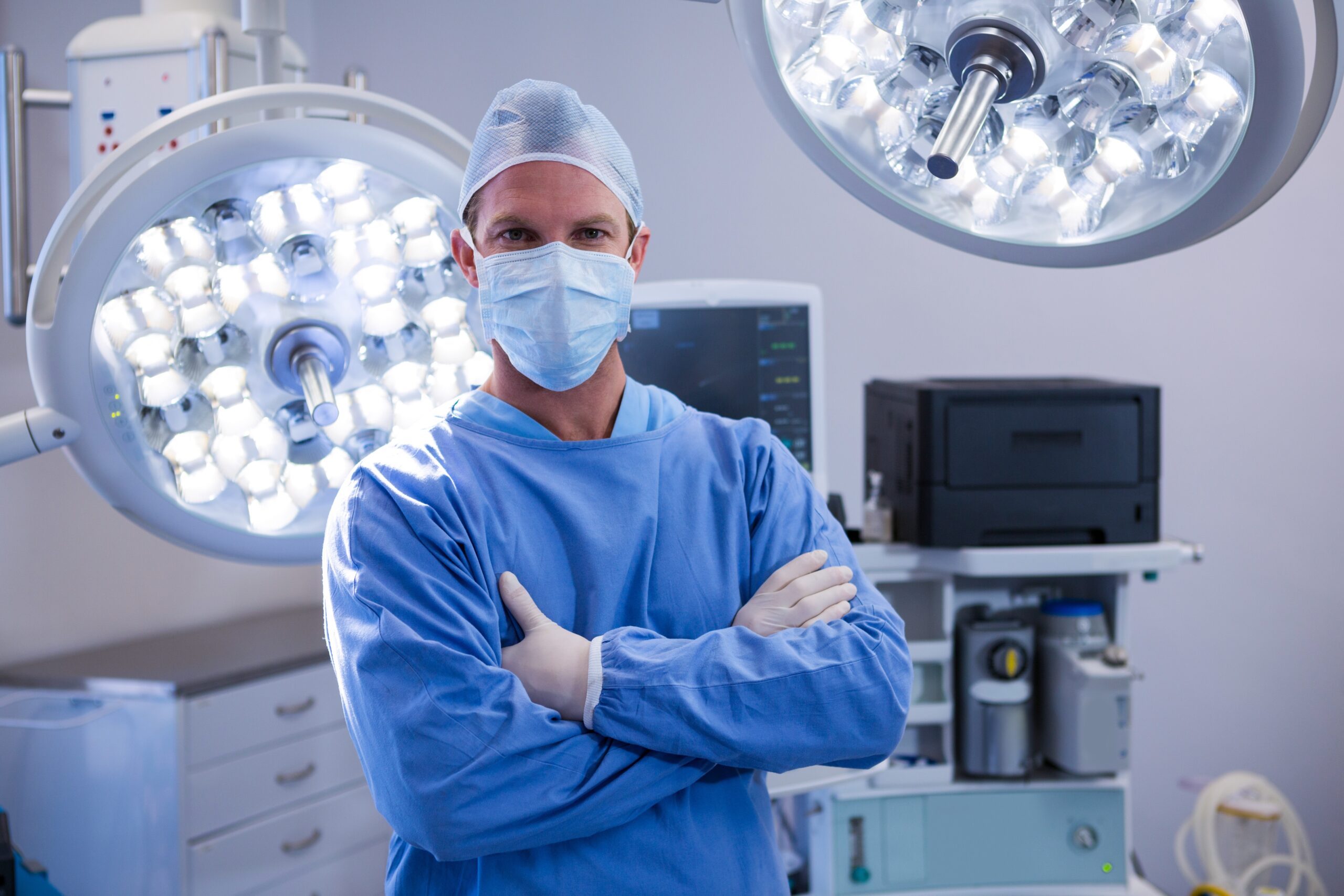 Portrait of male surgeon standing in operation theater